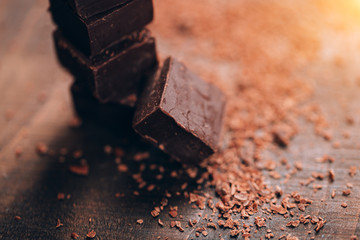 Dark chocolate on wooden table