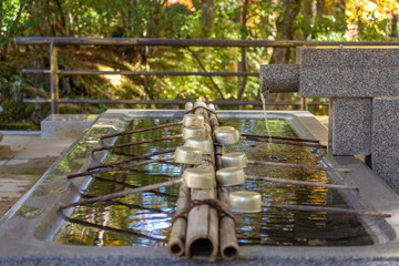 Closeup of holy spring water for cleansing ritual in Danjo Garan temple, one of the two sacred...