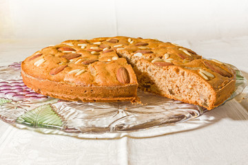 Zelten, rustic South Tyrolean cake on white tablecloth.