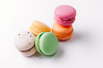 Macarons pattern on white background. Colorful french desserts. Top view. Flat lay