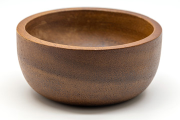 Close up a wooden bowl isolate on white background.