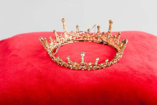 Royal Crown On Red Pillow Isolated On White