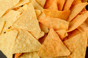 Closeup on nachos. Crispy tortilla chips served as snacks