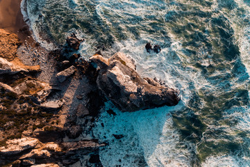 Cabo da Roca Portugal cliffs on the sunset ocean from the above drone