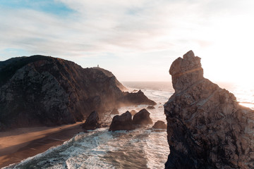 Cabo da Roca Portugal cliffs on the sunset ocean from the above drone