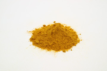 Turmeric extract powder on a white background is used as a tonic for the body and food ingredients.