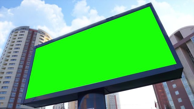 Green screen billboard on urban, city life. Blank advertisement panel, banner for marketing. Chroma key empty sign.