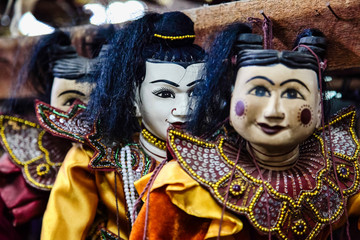 Fototapeta na wymiar Traditional handicraft puppets are sold in a market at Mandalay, Myanmar.