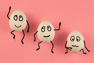 Chicken eggs with different emotions of joy, anger, indifference, anger. on a pink background....