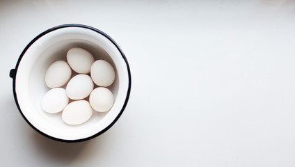 eggs in a bowl on white background
