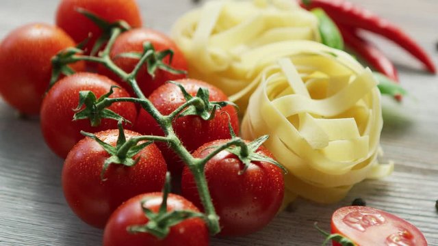 Uncooked pasta bunches with tomatoes