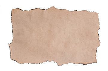 A sheet of rough brown paper with burned edges. Copy space