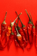 Fotobehang Red chili peppers are known as paprika © taffpixture