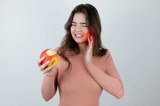 Young Beautiful Woman Feeling Extreme Toothache After Biting Fresh Apple Isolated White Background