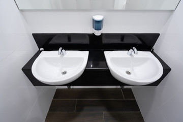 Modern faucet and white ceramic washbasin sink bathroom interior building decoration