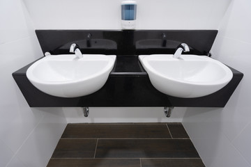 Naklejka na ściany i meble Modern faucet and white ceramic washbasin sink bathroom interior building decoration