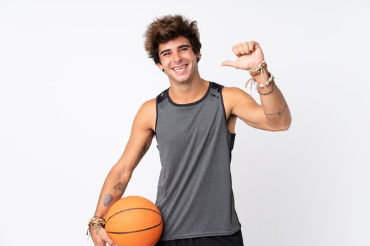 Young Caucasian Man Over Isolated White Background Playing Basketball And Proud Of Himself