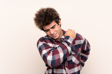 Young caucasian man suffering from pain in shoulder for having made an effort