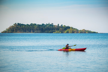 Fototapeta na wymiar A man kayaking in the sea Ko Chang