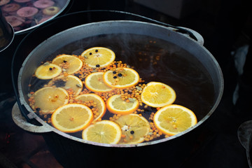 drink citrus punch with sea buckthorn hot outside in a pot