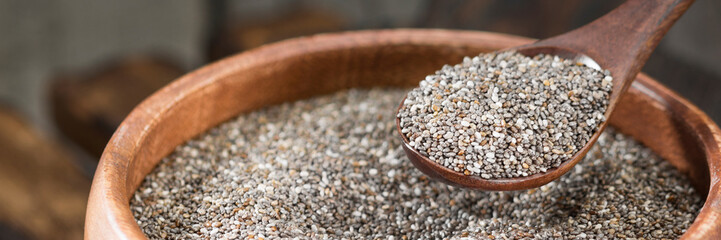 Chia seeds in a wooden spoon. Banner for the site. Vegetarian superfood for healthy eating