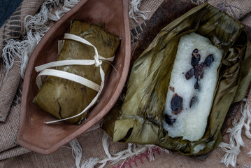 Khao tom mat, a Laotian and Thai dessert of seasoned steamed sticky rice wrapped in banana leaves...