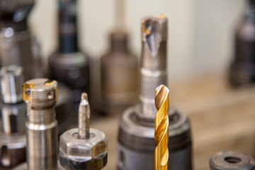 The special purpose drill tools coating by gold in the tool room.The  various type of cutting  tool for CNC milling machine.