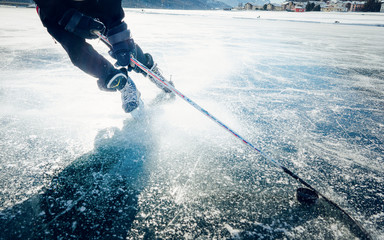 Winter sports ice skating on a sunny day. Ice skating in nature. Scenic panoramic view of the...