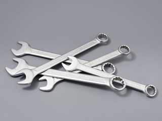 auto repair wrenches on a gray background