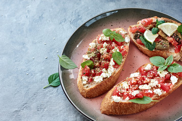 Bruschetta with vegetables and cheese.