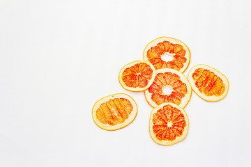 Dried slices of grapefruit isolated on white background