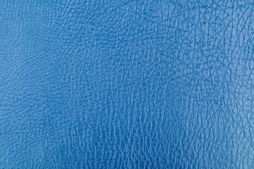 Texture of a blue leather background.