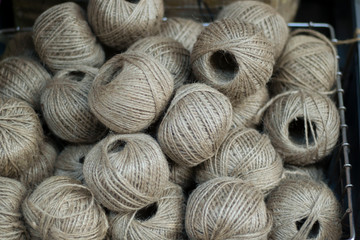 Round flax twine rope. There are a lot of round threads. It was taken in front of the market.