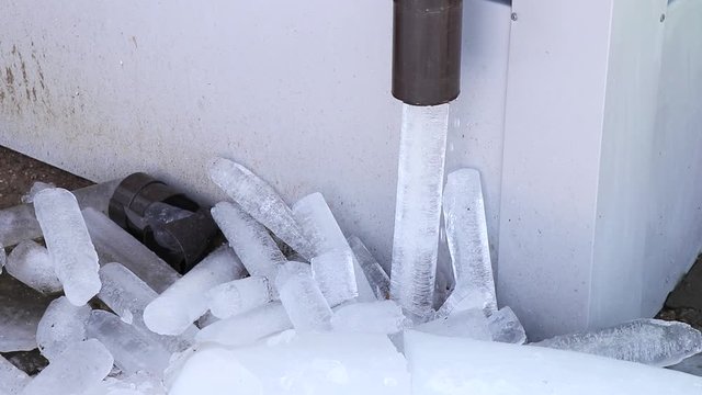 Frozen Water in Rain Gutter On Home. Winter 