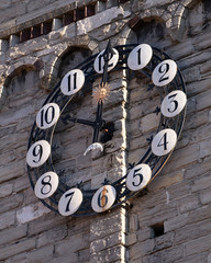 The clock of the church of San fedele. Como Italy