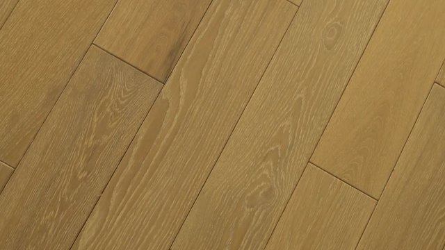 Close-up of Wooden Floors of Light Aak in a Modern Interior. Solid Wood Floors. Circular Slide