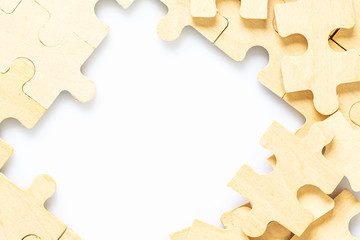 wooden jigsaw puzzle pieces on white background