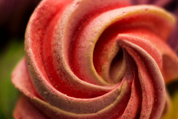 Macrophotography of meringue. Multicolored waves of cream