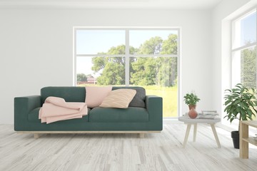 Stylish room in white color with sofa and summer landscape in window. Scandinavian interior design. 3D illustration
