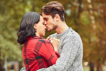 Fototapeta premium Couple in love hugging and kissing outdoors. Love concept.