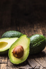 Fresh avocado on rustic wooden table - Close up
