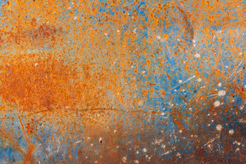 Old metal sheet. Rust texture. Old blue paint on a metal surface.