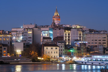 Fototapeta premium Istanbul, Turkey - Jan 10, 2020: Ferry boat in Golden Horn with Galata Tower in background, Istanbul, Turkey, Europe