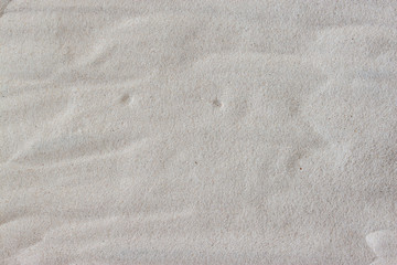 Fototapeta na wymiar white sand background. top view