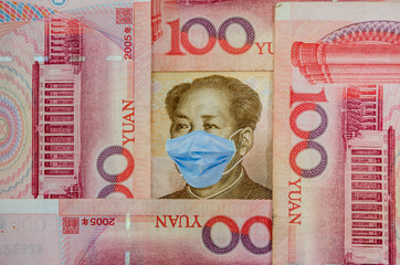 Coronavirus Wuhan Sars illness. Concept: Quarantine in China, 100 Yuan banknote with face mask....