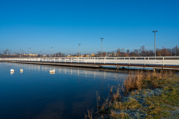 Fototapeta premium A large pier on a small lake in the city of Znin