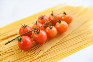 raw spaghetti italian pasta uncooked spaghetti yellow long with tomato ready to cook in the restaurant italian food and menu
