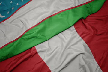 waving colorful flag of peru and national flag of uzbekistan.