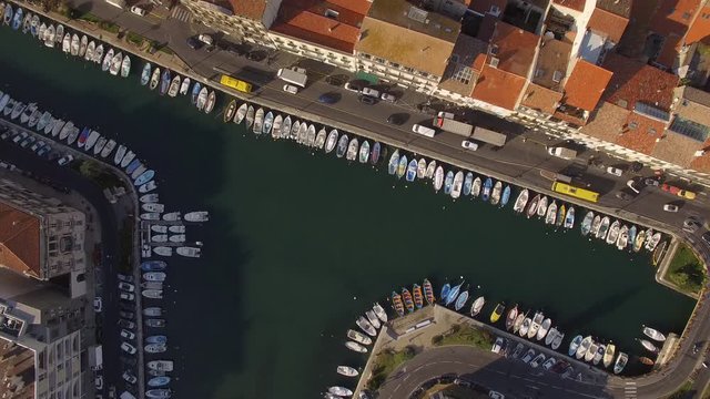 Sunrise top shot on S&egrave;te and its channels in the middle of the city. Nice colors and small fishing boats of the Venice of Languedoc.