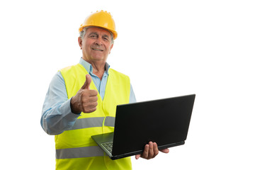 Architect holding laptop making like gesture
